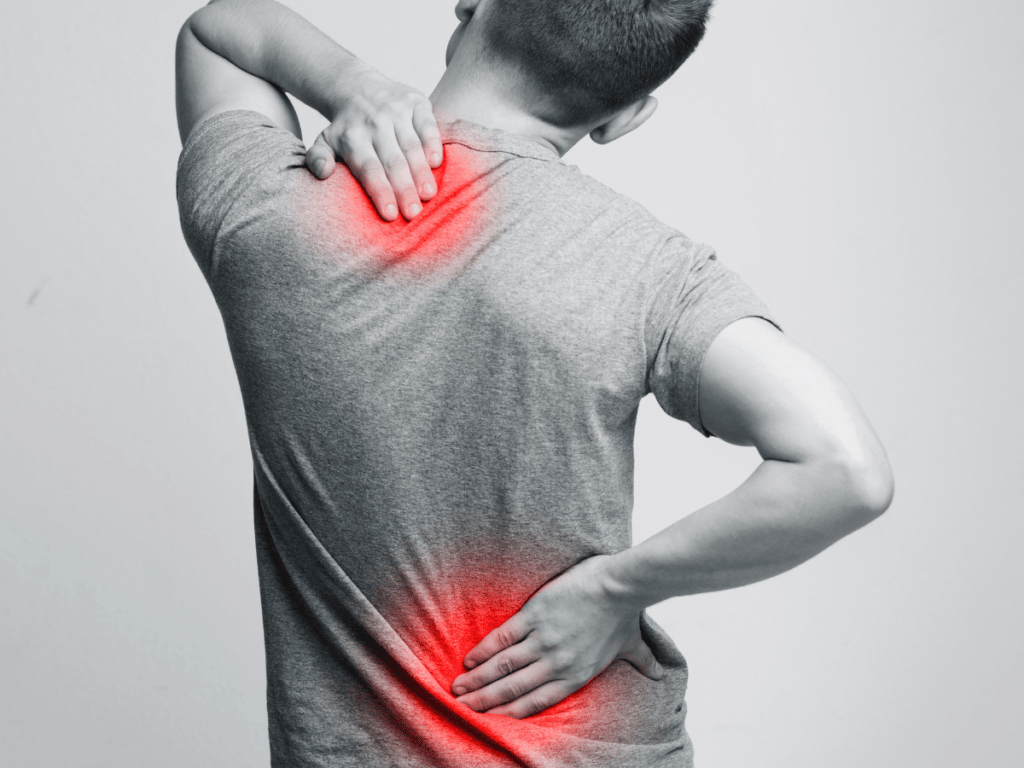 Man holding his upper and lower back in pain, with red highlighted areas indicating discomfort.